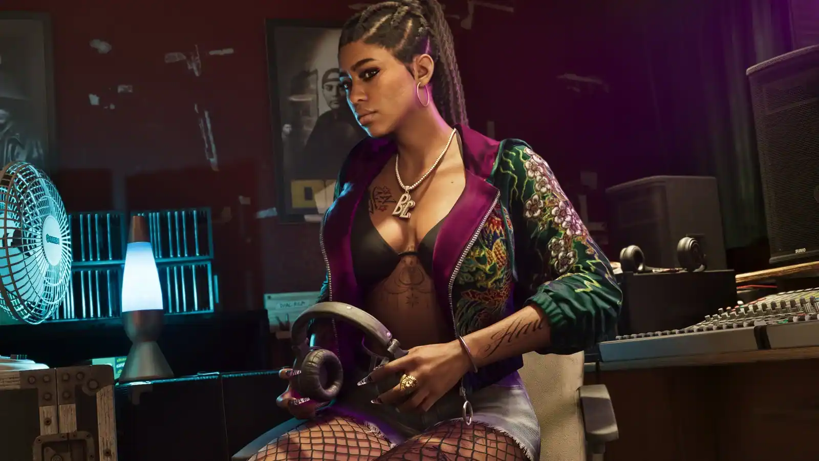 Bae-Luxe sits in the recording studio holding headphones